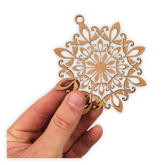 Decorative hanging mandala wooden blank cut out of 3mm MDF held in hand