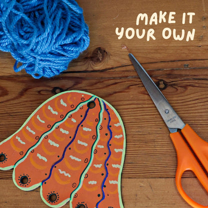 Craft materials including yarn, jelly fish laser cut out, and scissors.