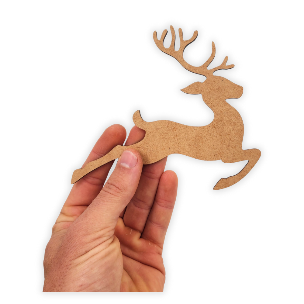 Prancing Reindeer in the snow wooden cutout