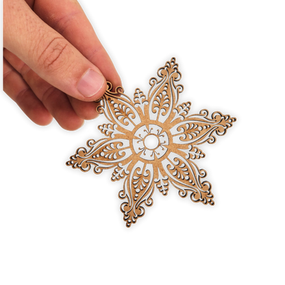 Decorative star shaped mandala wooden blank cut out of 3mm MDF held in hand