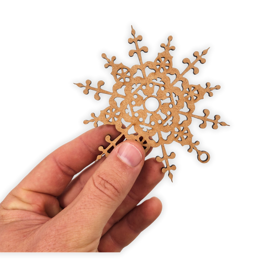 Decorative Twelve Point mandala wooden blank cut out of 3mm MDF held in hand