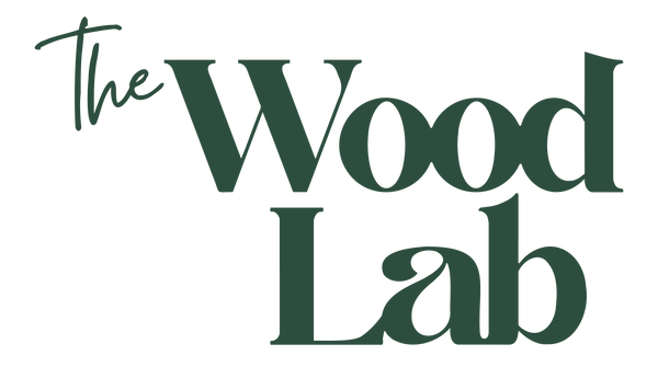 Logo of The Wood Lab with green text on a white background